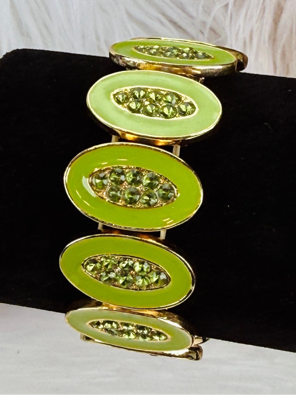 Pretty goldtone and green enamel bling costume stretch bracelet